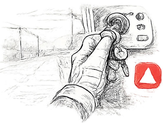 A stopped machine with the key removed and a hand kept away from the rotor area while clearing material.
