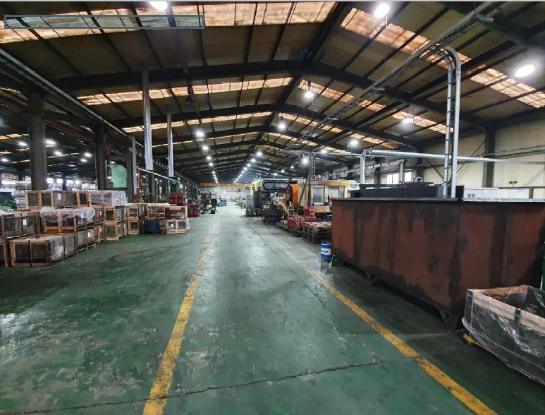 Main shop floor at the WeCan plant with work cells and staged material