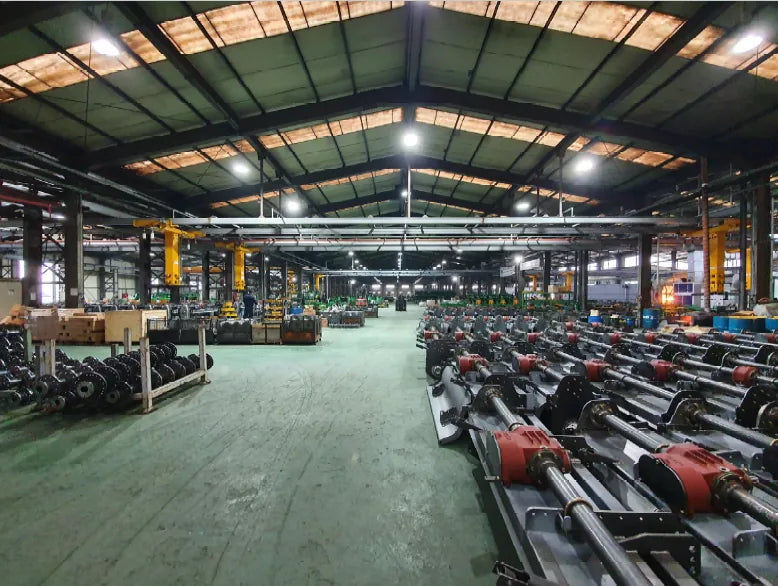 Finished WeCan rotavator frames and gearboxes lined up on the assembly floor